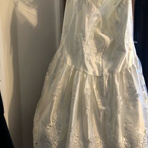 Off shoulder cream bridal shower dress.